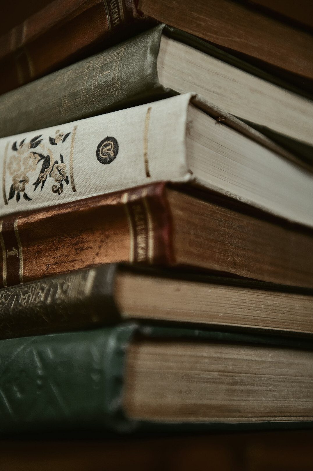 Stack of old books with worn covers
